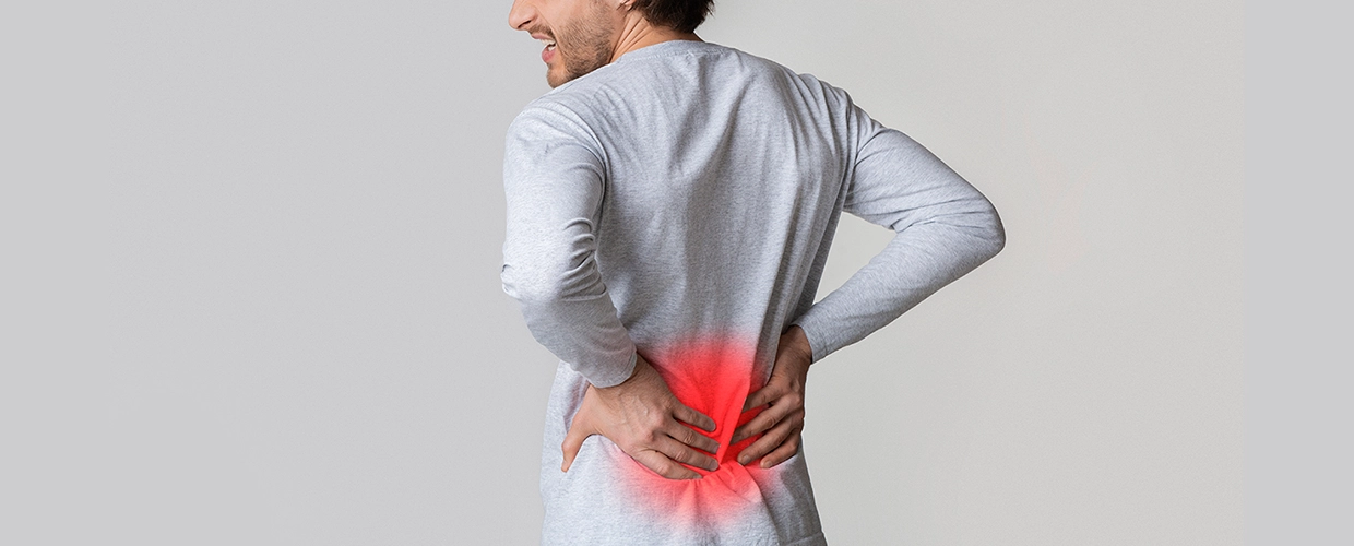 Почему возникает боль в пояснице